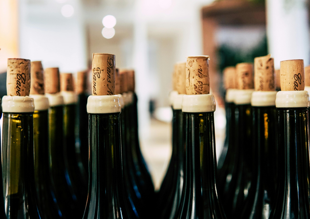 Open wine bottles with corks
